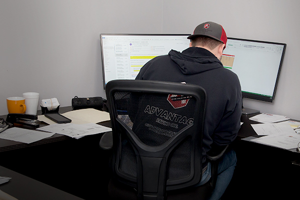 Denler Employee Working at Desk