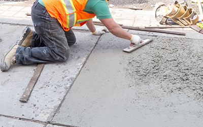 Denler Employee Laying Concrete